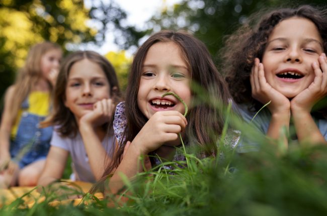 front-view-smiley-kids-outdoors